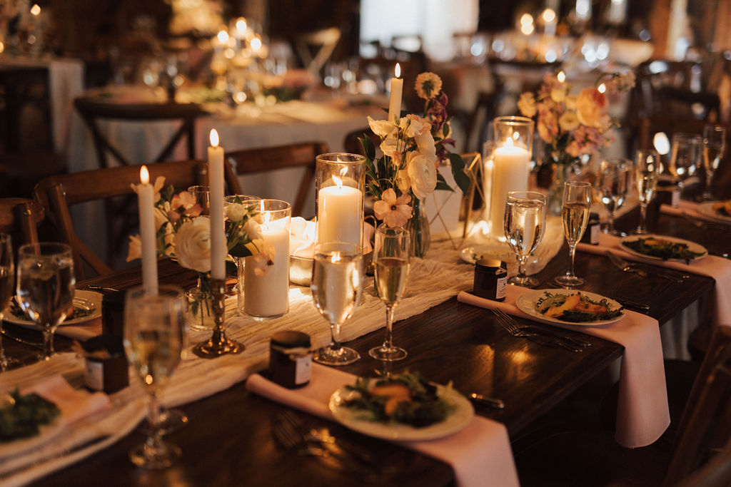 Table adorned with romantic linens, candles and flowers
