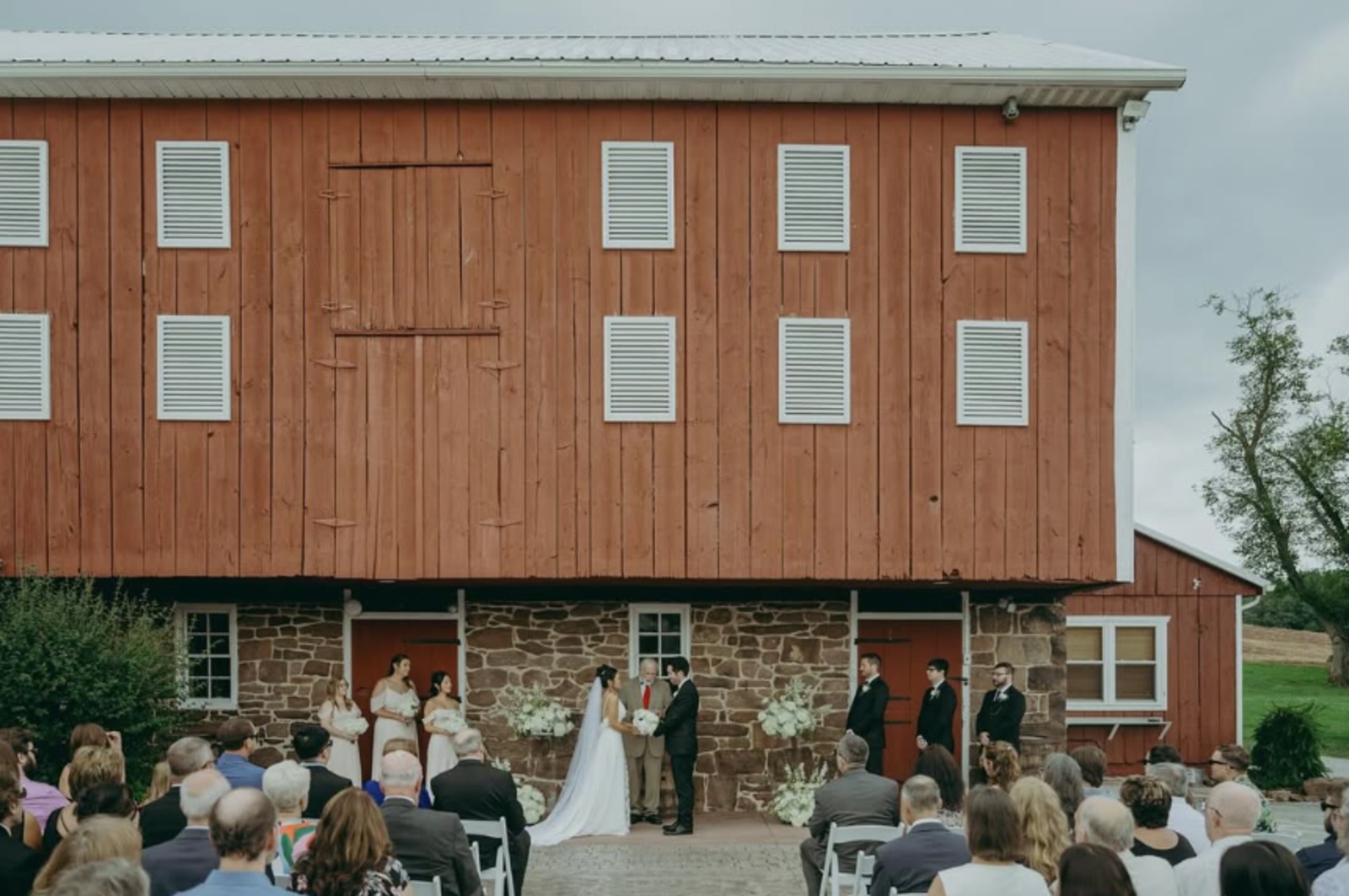 Outdoor Wedding Ceremony at The Looking Barn in Fairfield PA Outdoor wedding ceremony in front of the historic barn at The Looking Barn in Fairfield, PA.