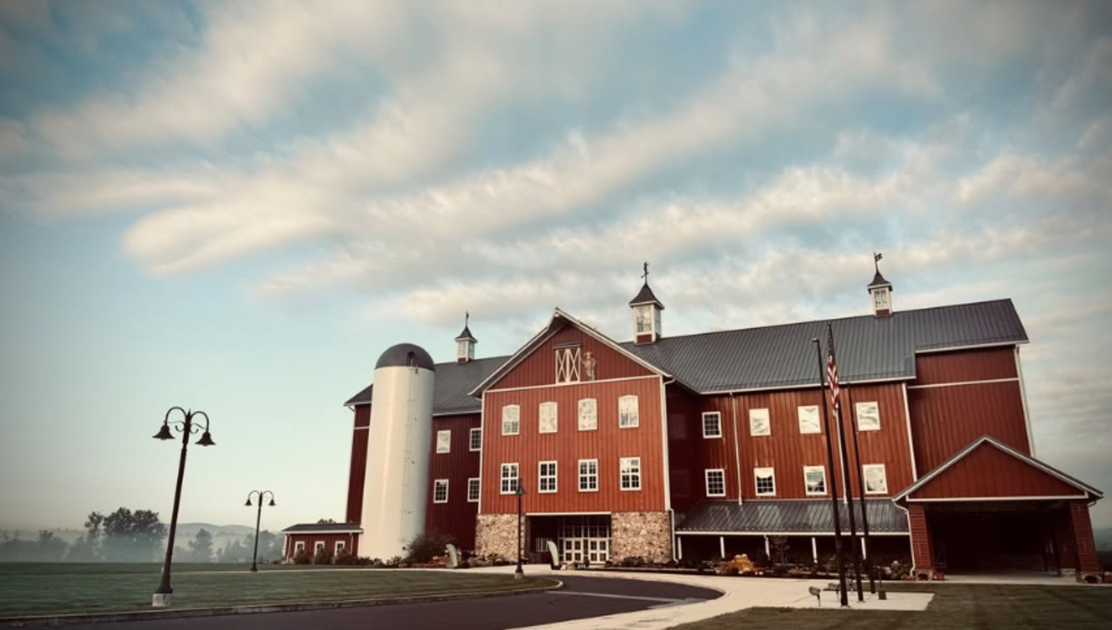 The Barn Resort Wedding Venue in Gettysburg PA The Barn Resort wedding venue in Gettysburg, PA, featuring a large red barn and silo.