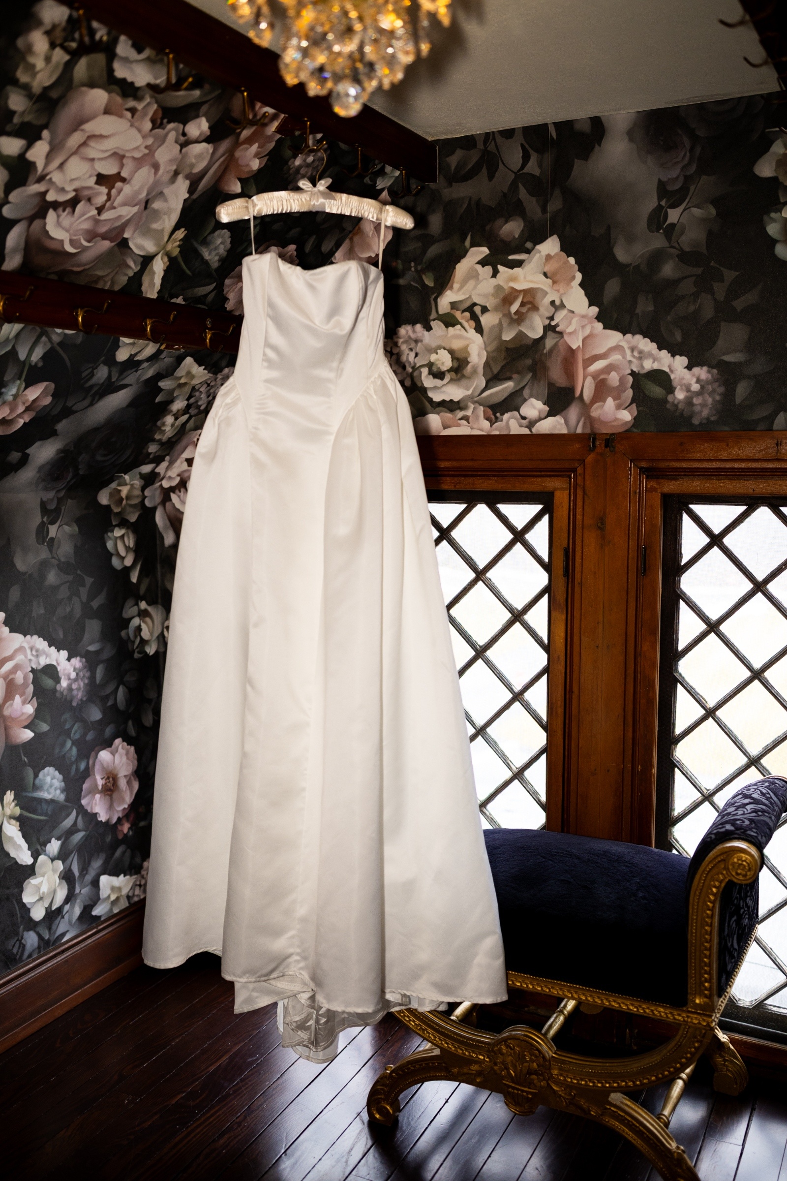 Wedding Dress Details at The Willows at Ashcombe Simple satin wedding dress hanging in a bridal suite at The Willows at Ashcombe before a Pennsylvania elopement ceremony.