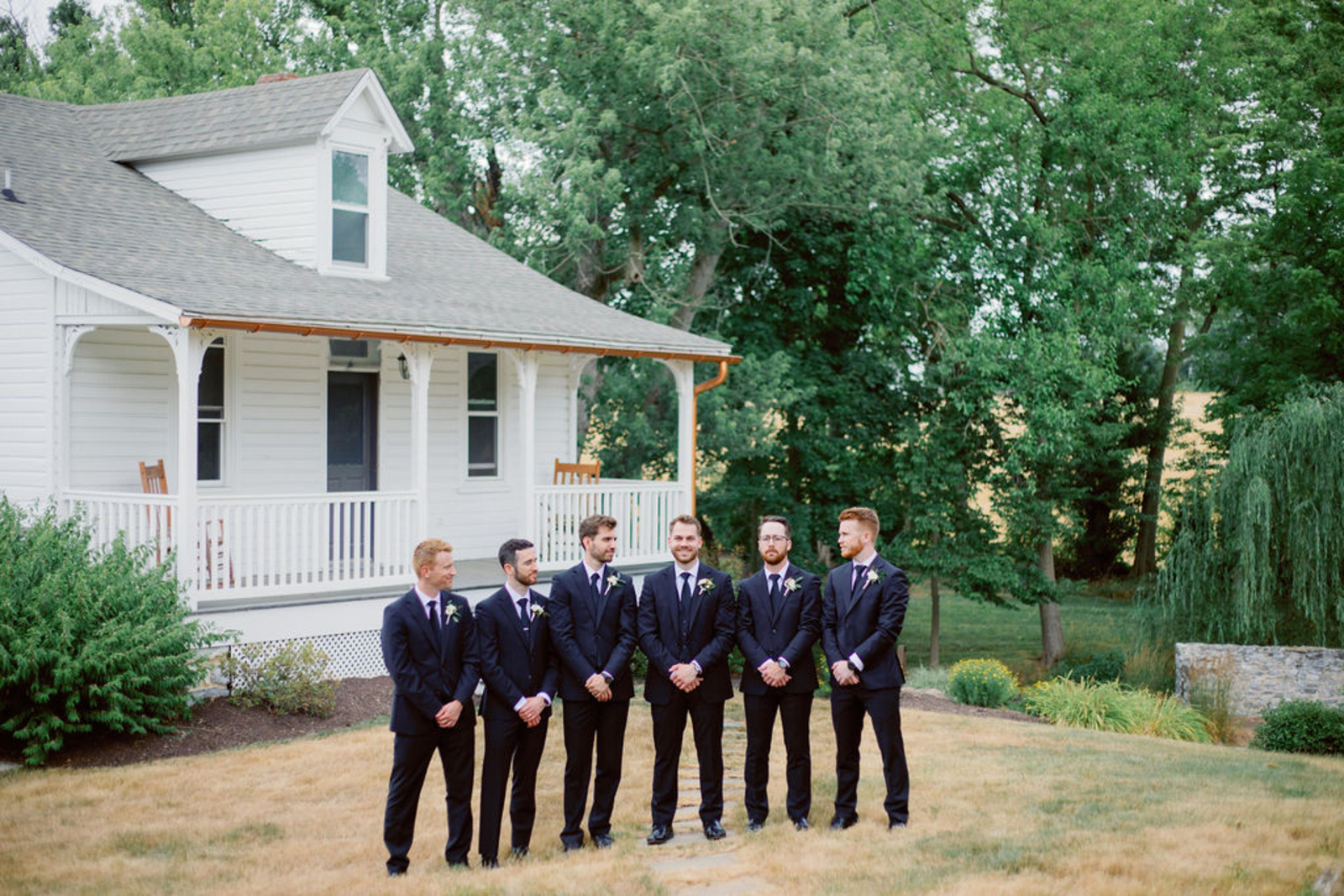 Groomsmen Portrait at Historic Ashland Groom and groomsmen in navy tuxes posing outside Historic Ashland before the wedding ceremony.