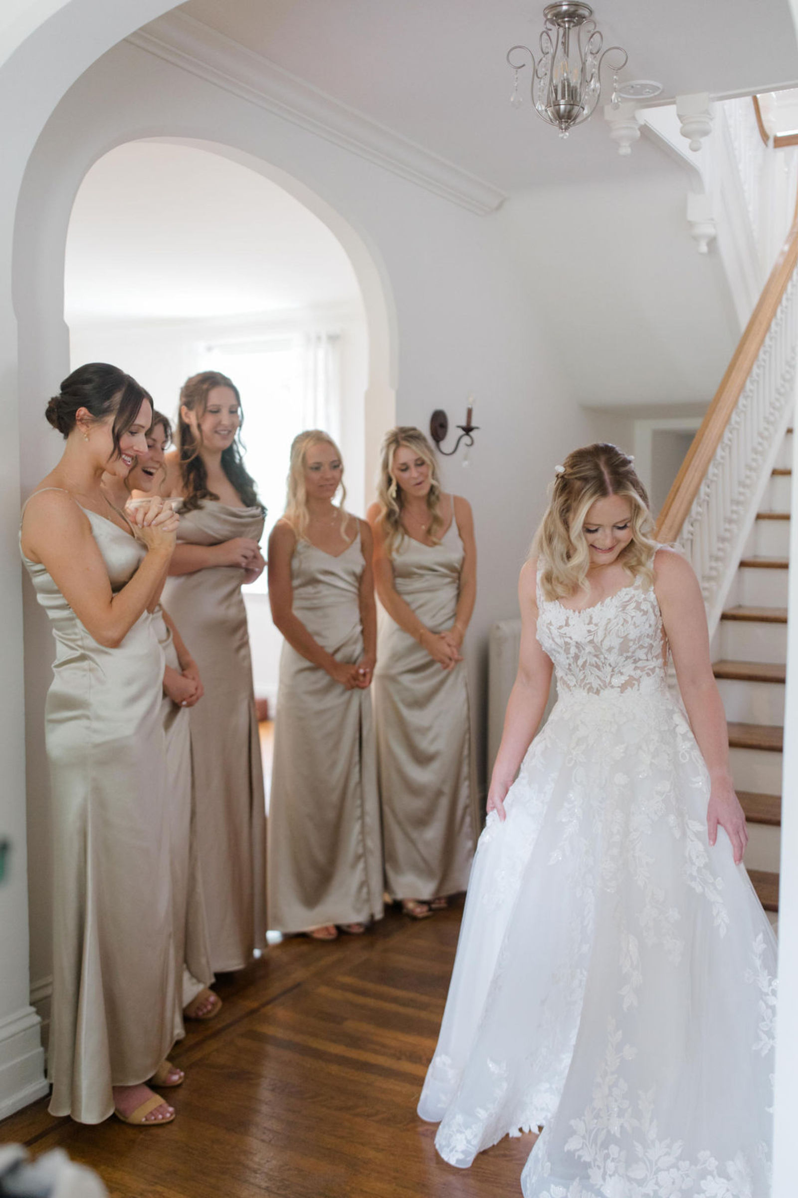 Bridesmaids Seeing the Bride for the First Time Bridesmaids reacting to the bride in her floral lace wedding gown inside Historic Ashland before the ceremony.
