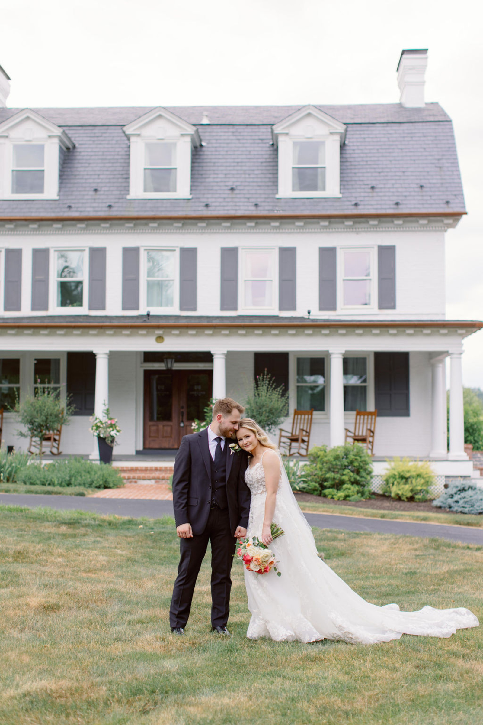 Bride and Groom Portrait in Front of Historic Ashland Bride and groom standing together in front of Historic Ashland during romantic outdoor wedding portraits in Central Pennsylvania.