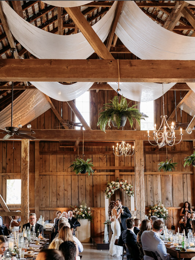 Stoltzfus Homestead Grand Barn Wedding reception inside the historic Grand Barn at Stoltzfus Homestead & Gardens in Gordonville, Pennsylvania