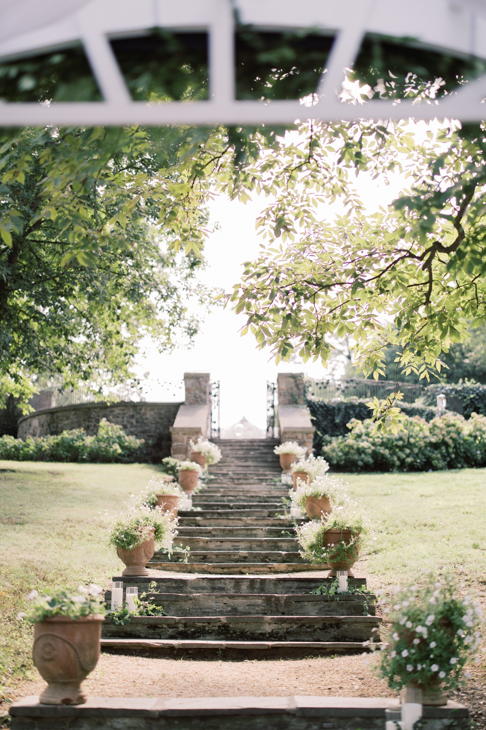 Stone ceremony steps lined with flowers at the Sunken Gardens at Lauxmont Farms wedding venue in Wrightsville Pennsylvania